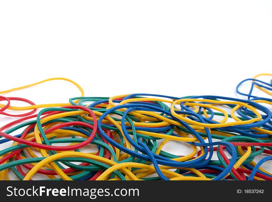 Colored rubber bands on a white background