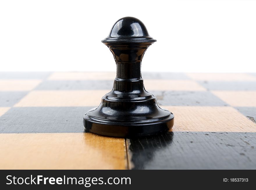 One old pawn in a white background. One old pawn in a white background