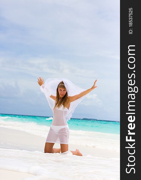 Bride on a coastline at tropical beach. Bride on a coastline at tropical beach