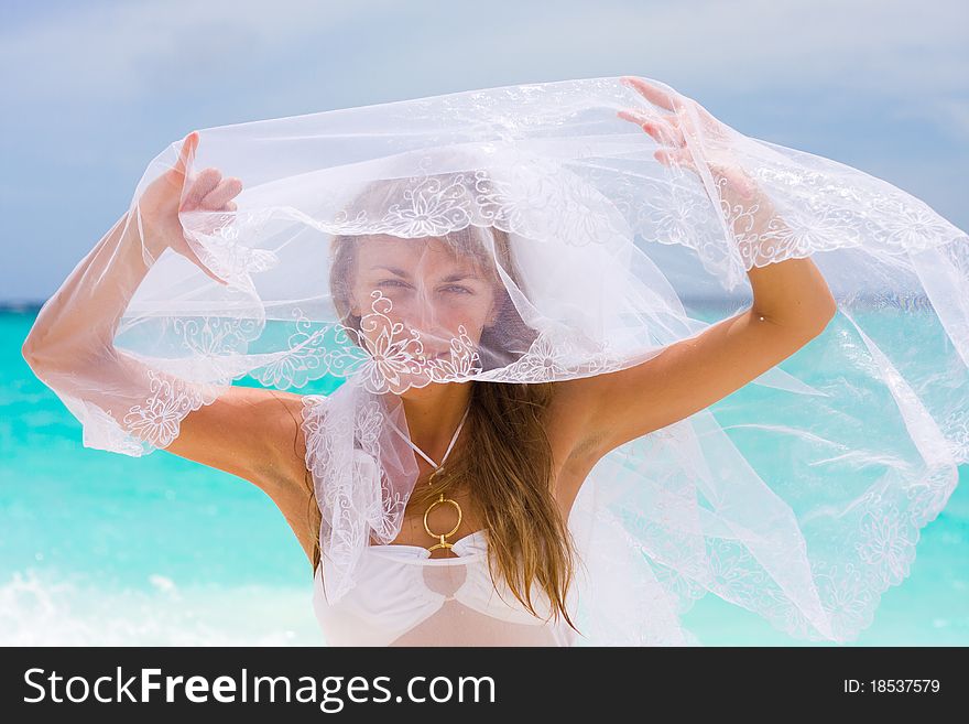 Bride on a coastline at tropical beach. Bride on a coastline at tropical beach
