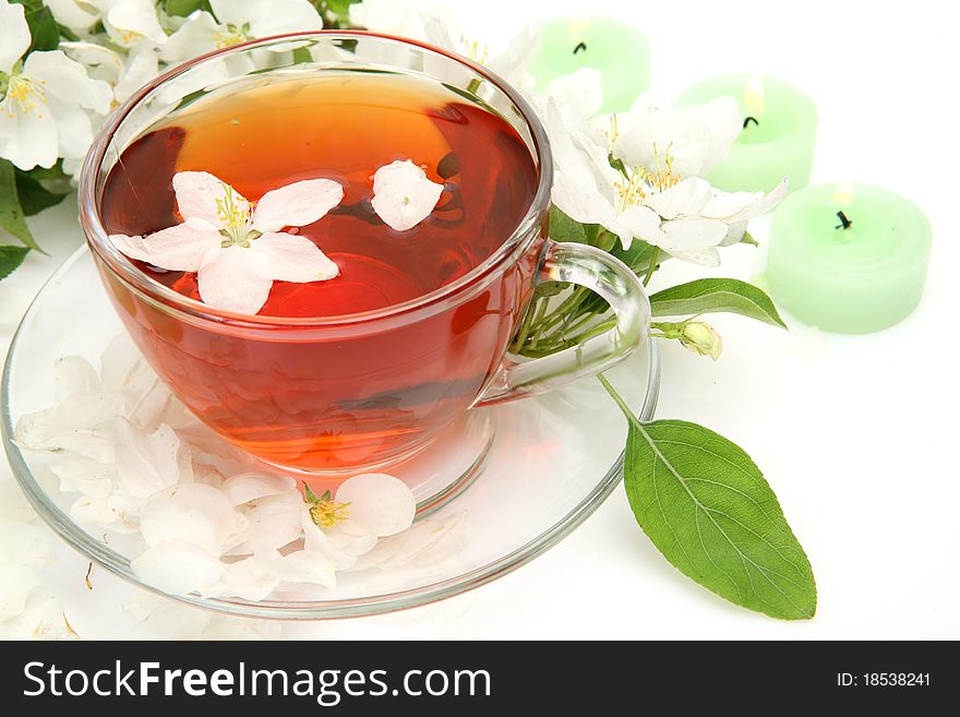 Tea and flowers on a white background