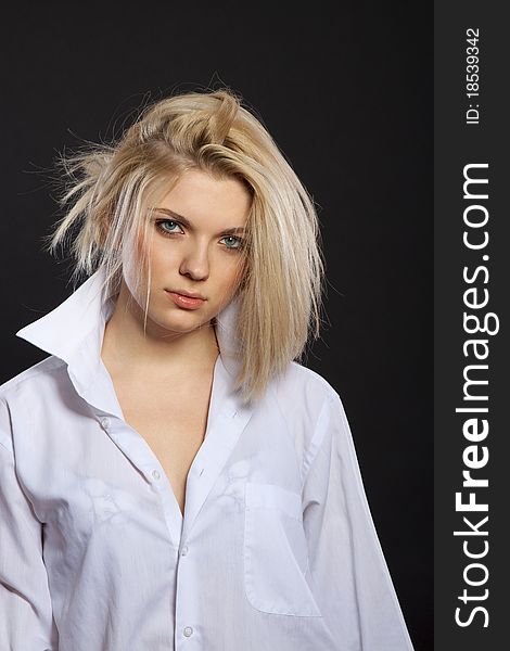 Fashion portrait of sensual blond in man's shirt