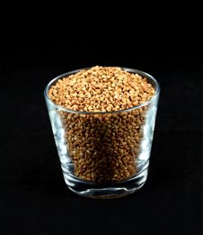 Buckwheat Millet Kernels In A Cup On Black Stock Photo Buckwheat Millet Kernels In A Cup On Black Stock Photo