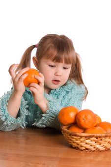 The Little Girl With Tangerines Stock Photography