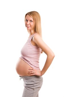Pregnant Blond Girl On White Background Royalty Free Stock Image