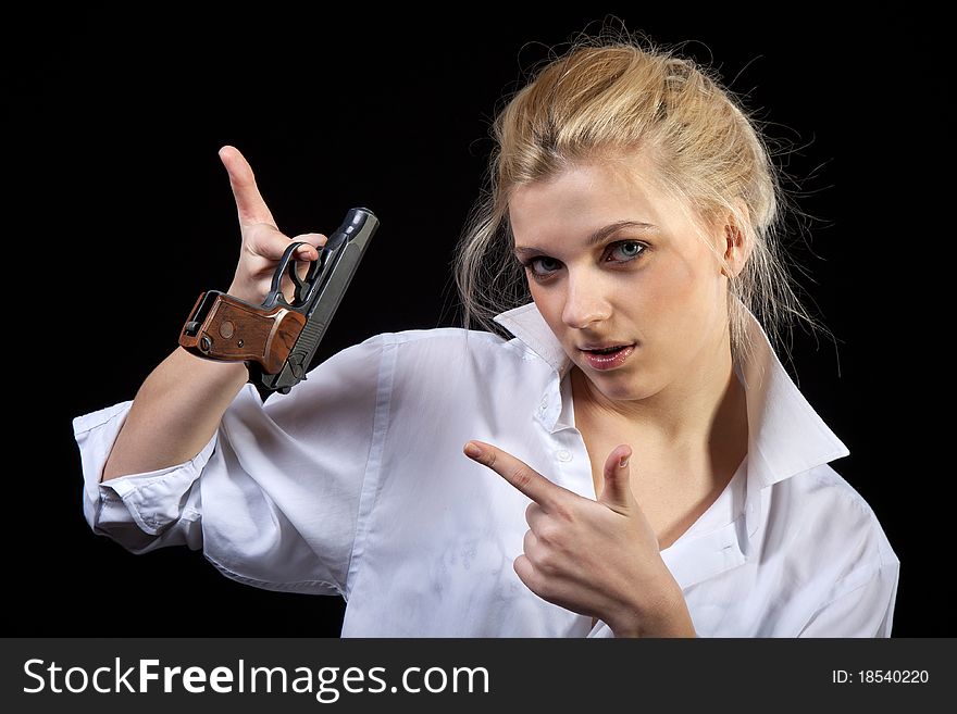 Beautiful girl holding gun, Isolated on black background. Beautiful girl holding gun, Isolated on black background
