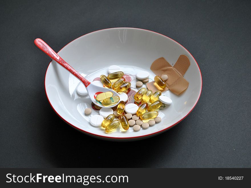 Image of a bowl with pills in it. Image of a bowl with pills in it