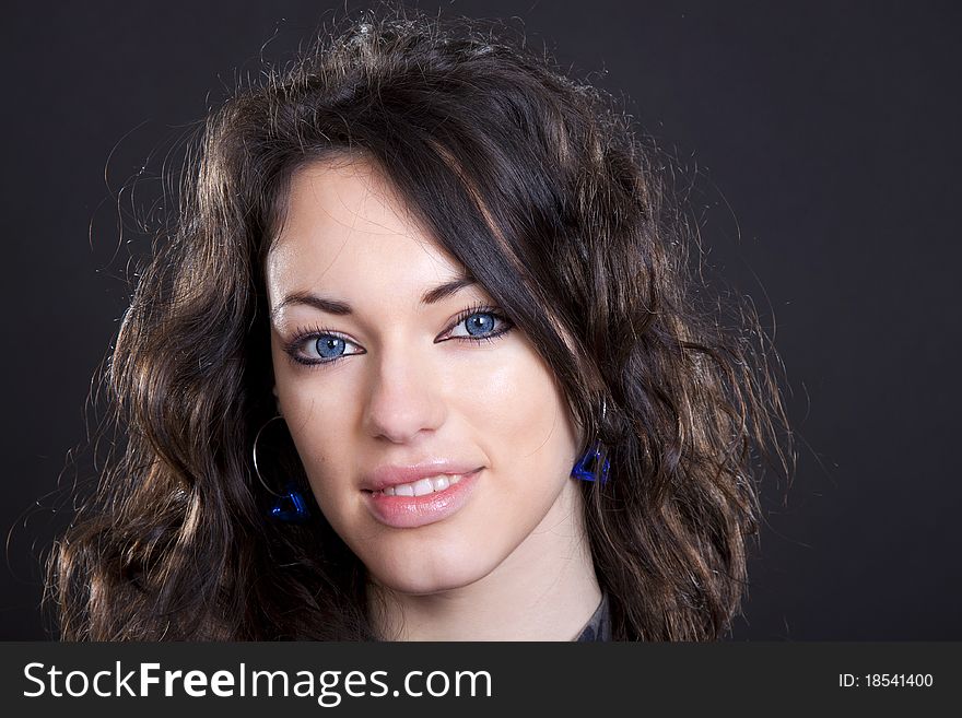 Black hair young caucasian charming woman portrait, studio shot. Black hair young caucasian charming woman portrait, studio shot