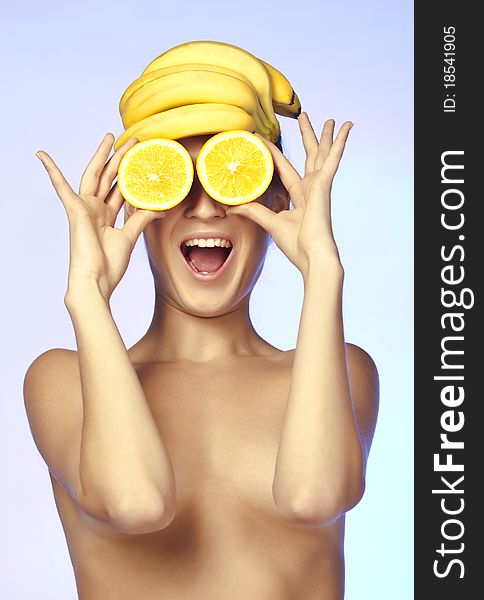 Topless beautiful woman, she holding orange slice