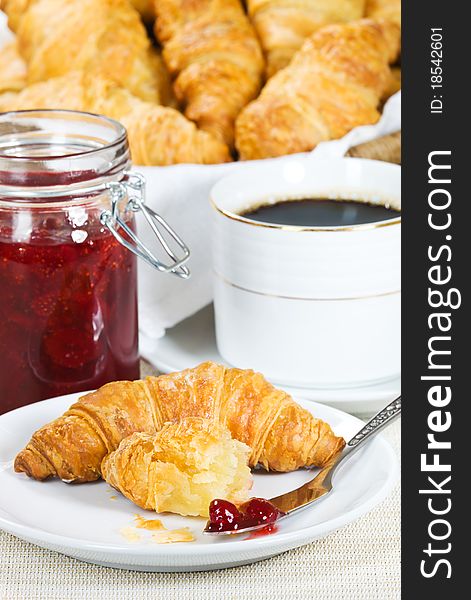 Croissant and strawberry jam