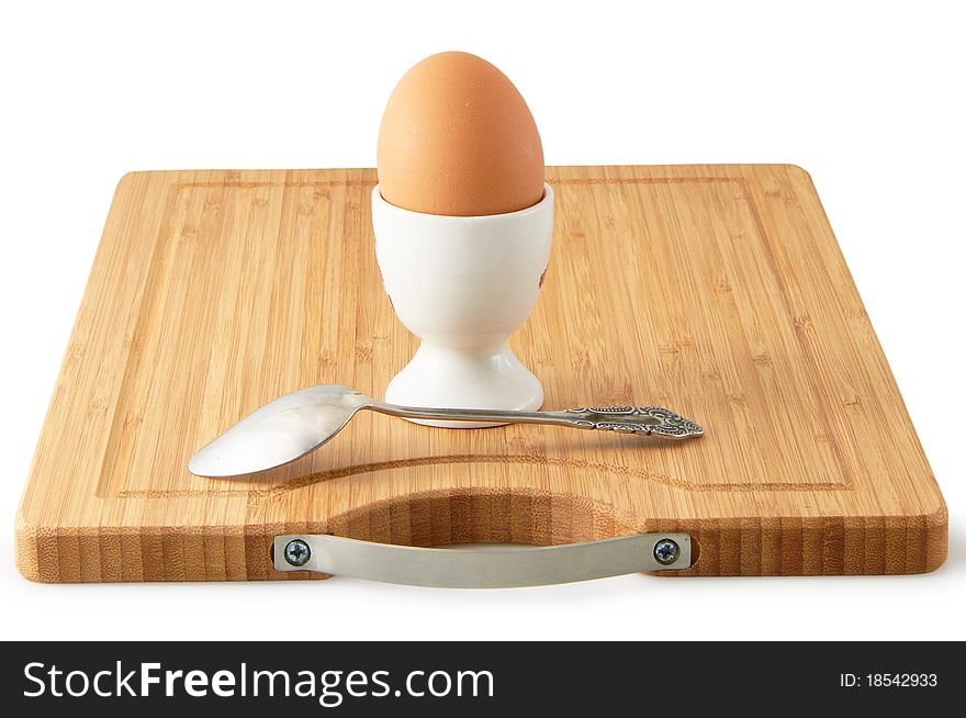 The egg on spoon isolated on a white background. The egg on spoon isolated on a white background