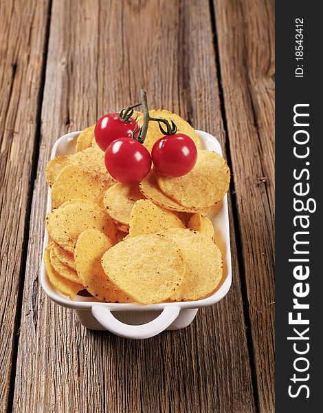 Crispy corn chips in a porcelain dish