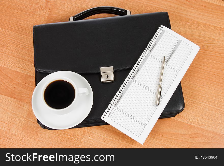 Black Portfolio And Coffee On A Table