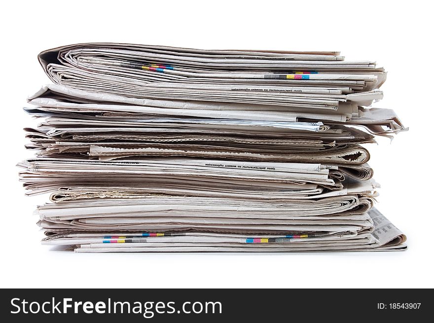 Various newspapers over white background