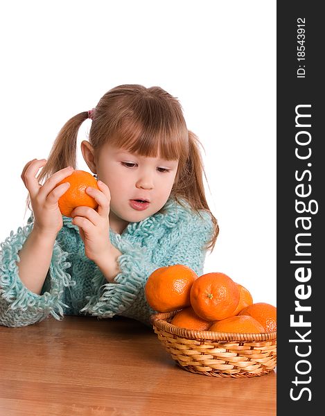 The little girl with tangerines on white