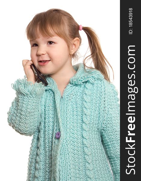 The little girl speaks by phone on white