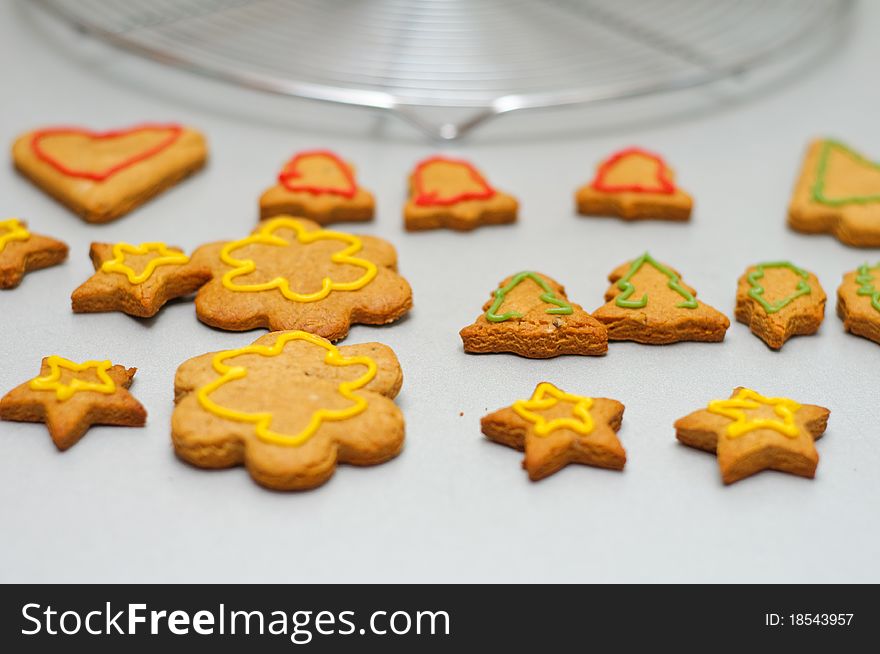 Different shape gingerbread cookies with sugar frosting