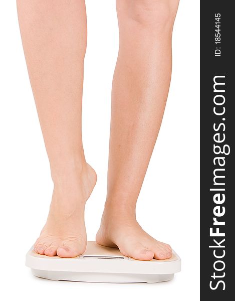 Female Feet On Scales Isolated