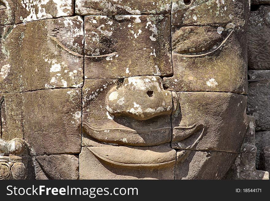 Stone head on towers of Bayon