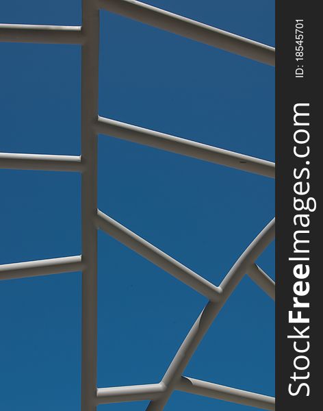 Suitable for backgrounds, for signage or for a stairway or ladder concept.  Blue sky as seen through an outdoor metal structure in a public park. Suitable for backgrounds, for signage or for a stairway or ladder concept.  Blue sky as seen through an outdoor metal structure in a public park.