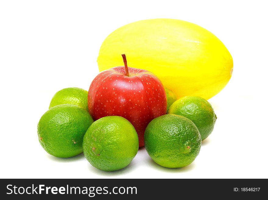 Colorful fruits melon, laime and apple isolated on white