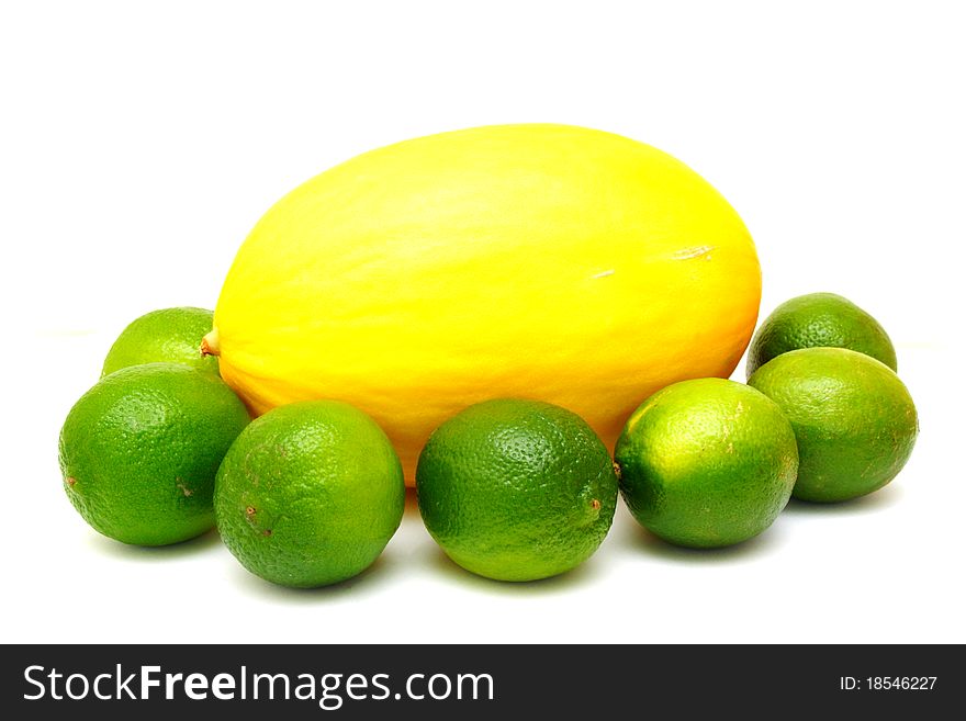 Yellow melon with green laime isolated on white