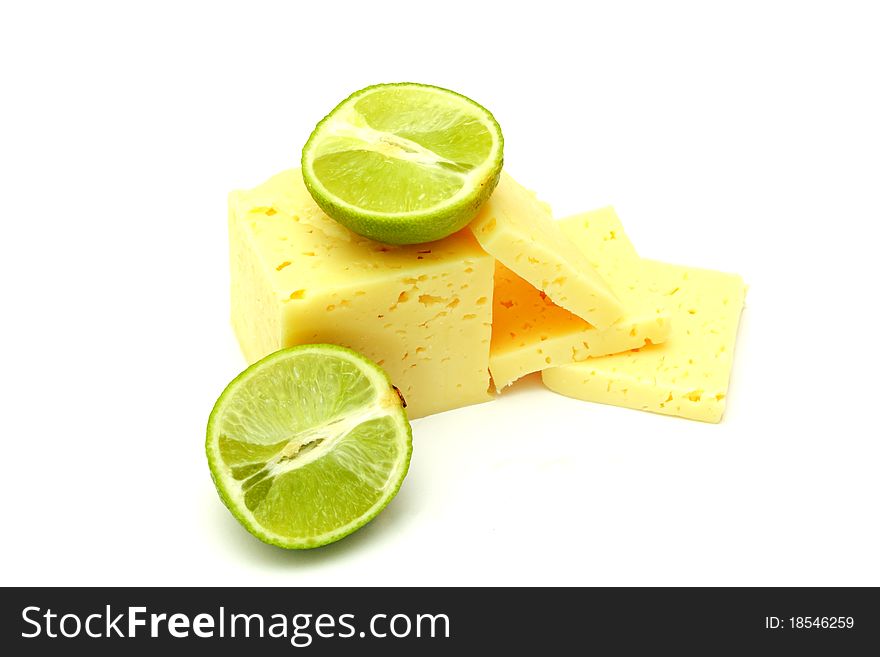 Slices cheese with laime on white background