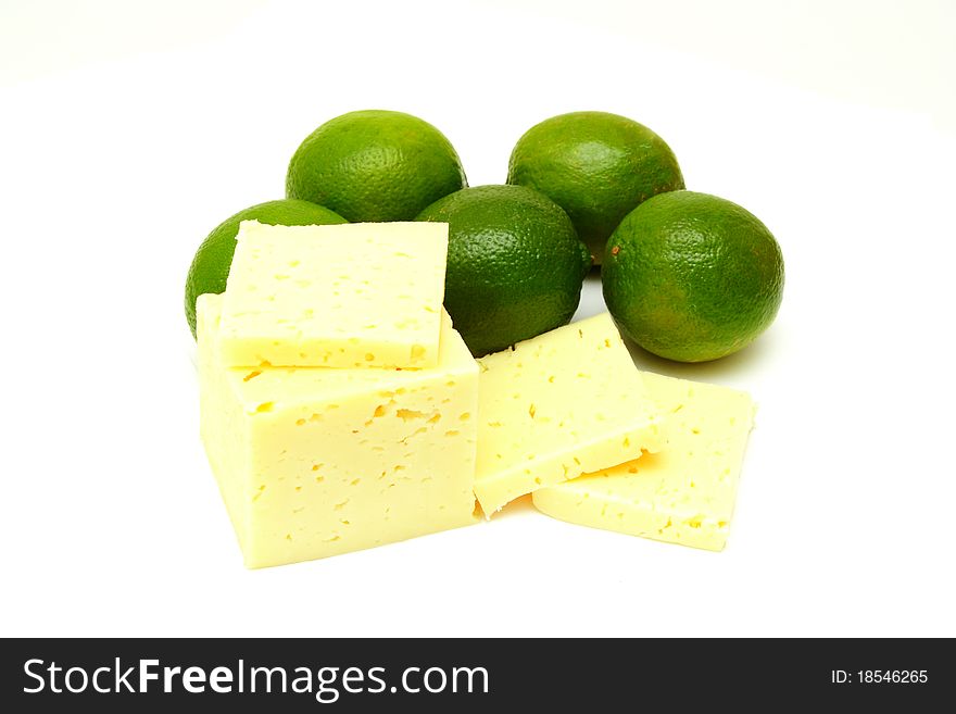 Slices cheese with laime on white background