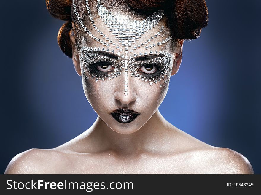 Beauty woman makeup with crystals on face