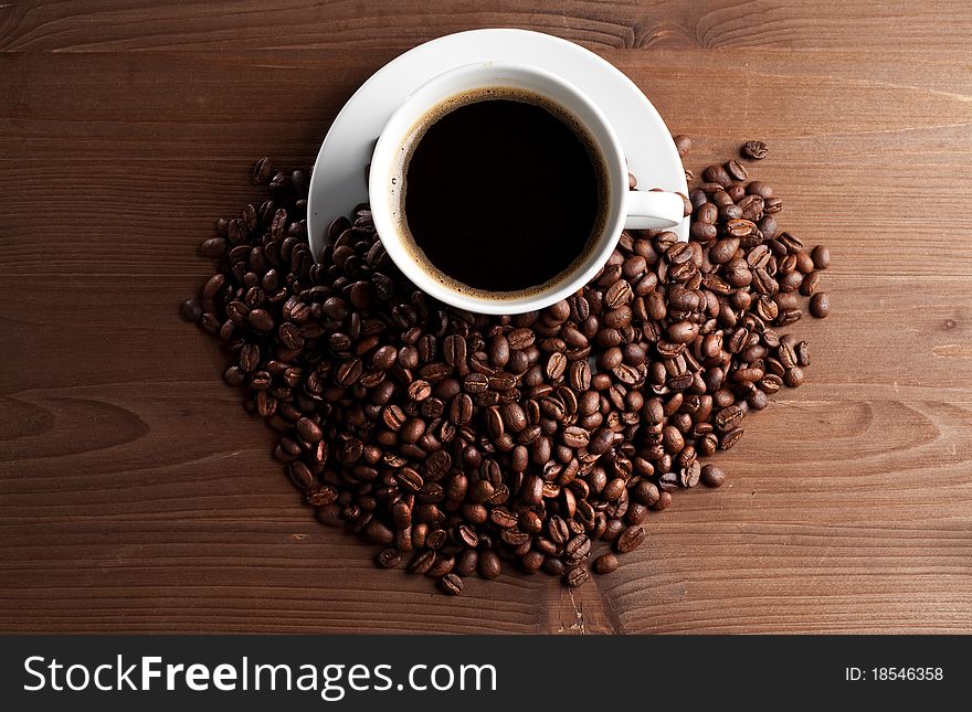 Warm cup of ciffee on brown background