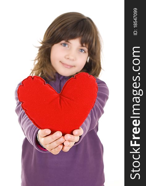 Happy little girl with red valentines heart - isolated