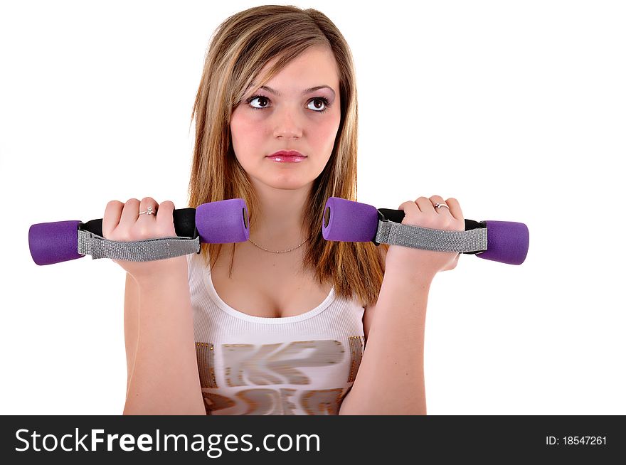 Portrait of fitness woman working out with free weights in gym