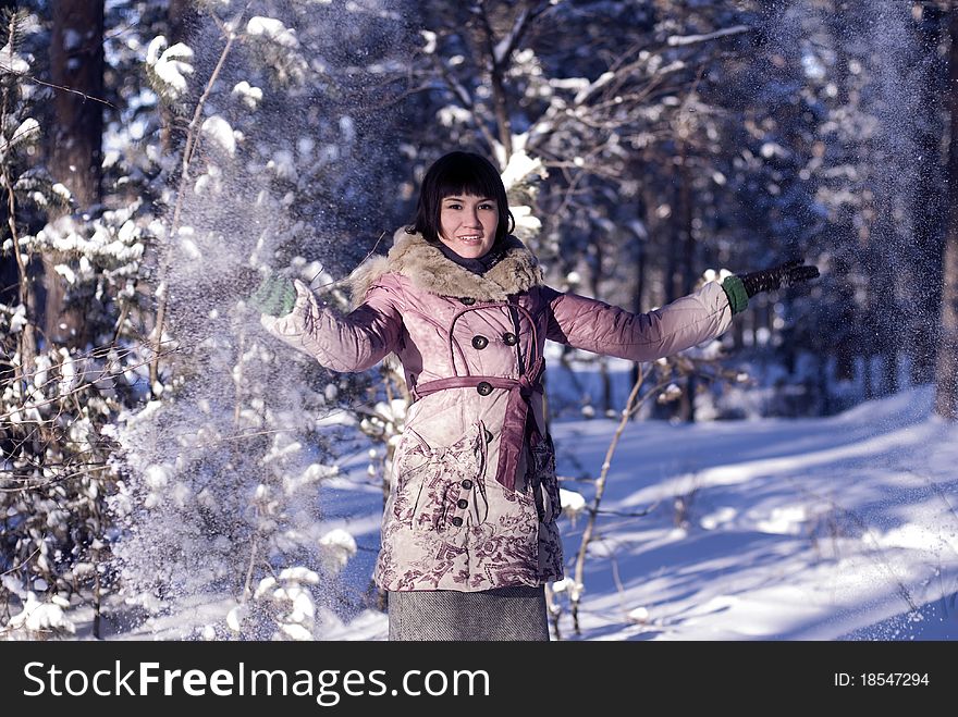 Nice young girl in winter forest with trees. Nice young girl in winter forest with trees