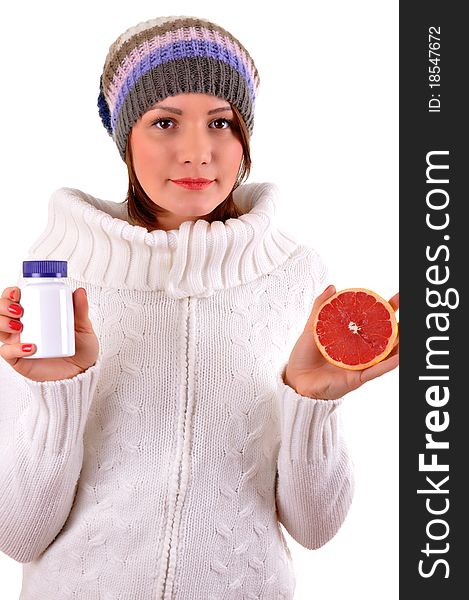 Woman's hands with orange and tablets