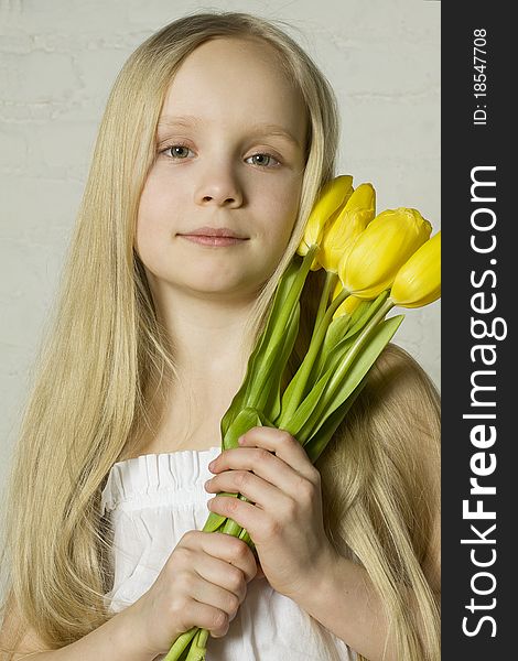 Young girl with yellow spring flowers. Young girl with yellow spring flowers