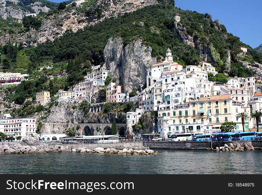 A beautiful view of the bustling Italian coast town Amalfi. A beautiful view of the bustling Italian coast town Amalfi.