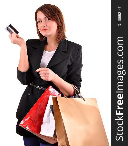 Portrait of stunning young woman carrying shopping bags against white background