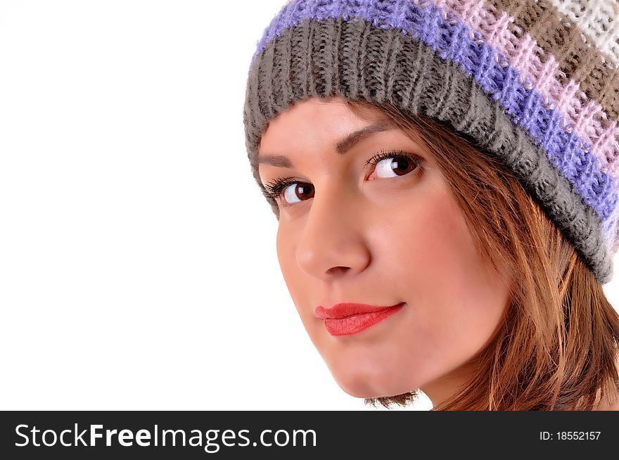 Close up of young woman with winter cap smiling isolated on white background