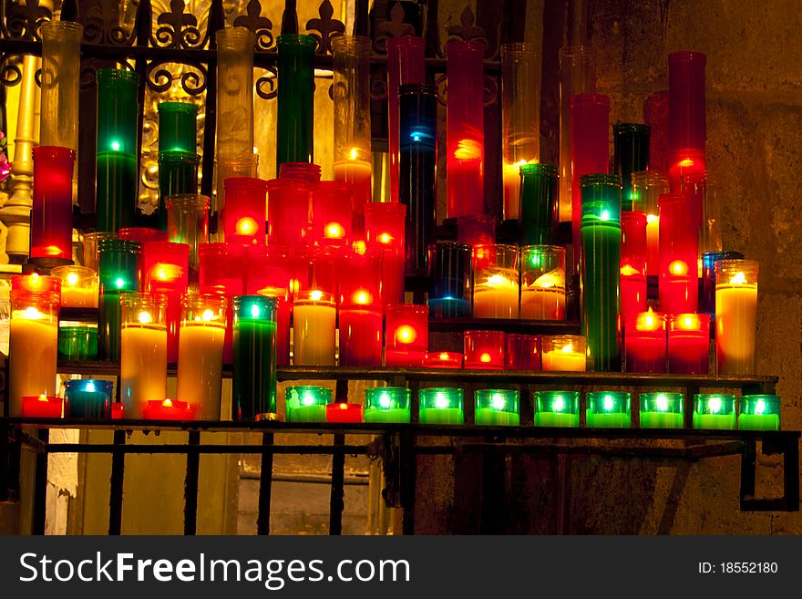 Colorful Lighted Candels in a Church. Colorful Lighted Candels in a Church
