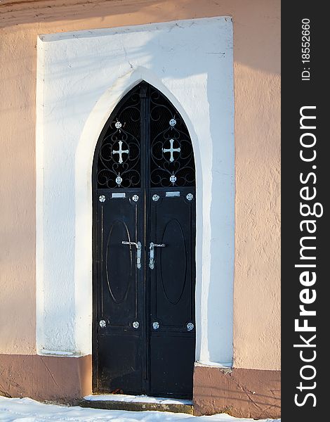 Detail of door to Small chappel in sunny day. Detail of door to Small chappel in sunny day