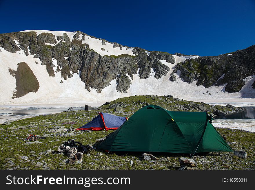 Bivvy wih tents in the mountains near of he lake. Bivvy wih tents in the mountains near of he lake