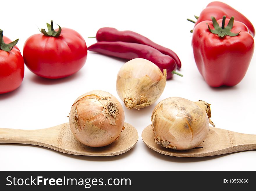 Raw onion on wood cook spoon. Raw onion on wood cook spoon