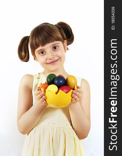 Girl keeping the basket with Easter painted eggs. Girl keeping the basket with Easter painted eggs