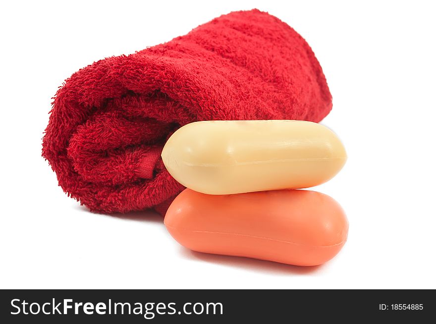 Towel and soap on a white background