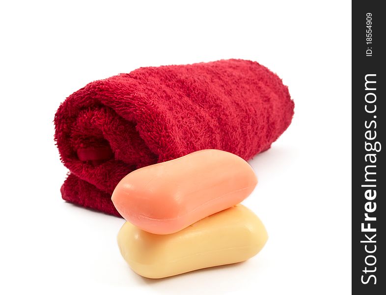 Towel and soap on a white background