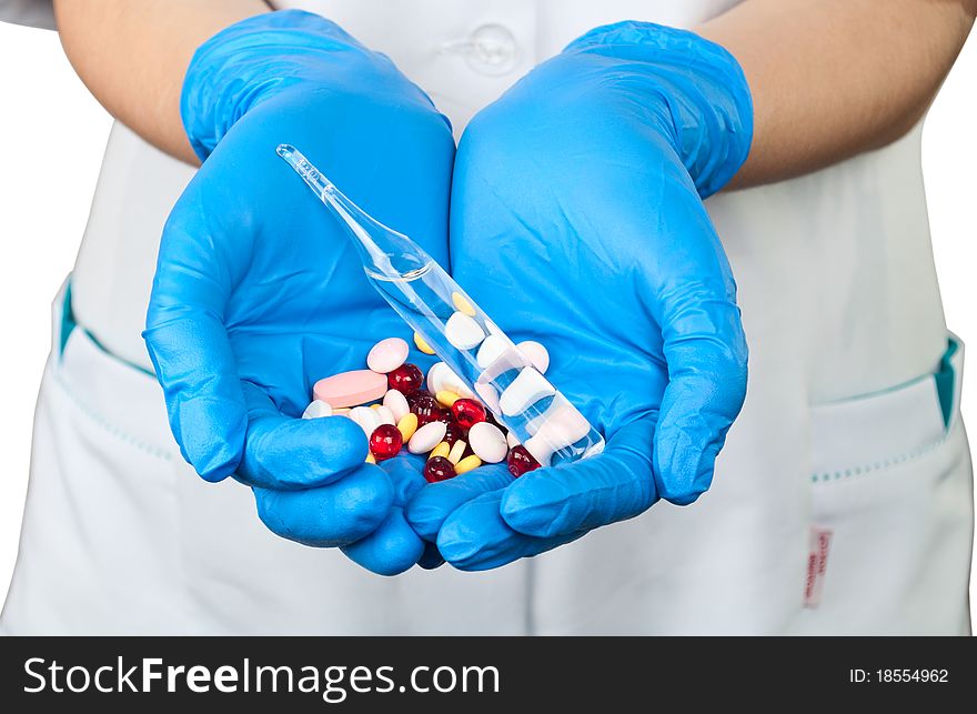 Drugs in the hands of a doctor on a white background