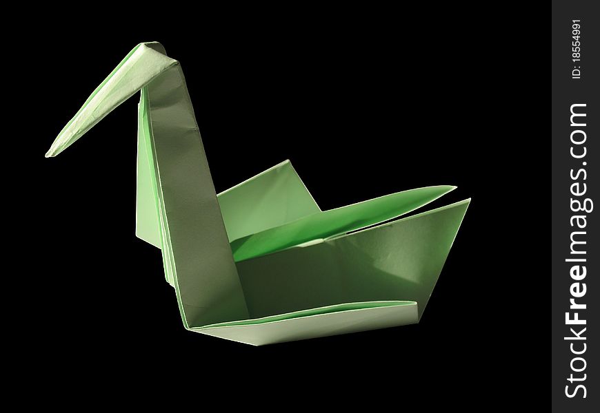 Origami green swan isolated on black