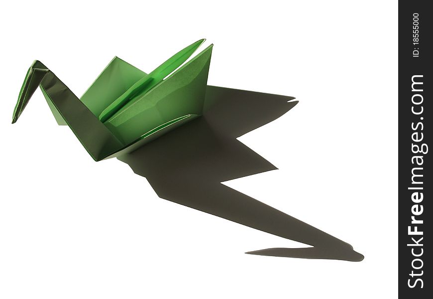 Origami green swan with shadow isolated on black