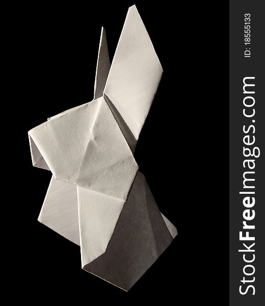 Origami white hare isolated on black