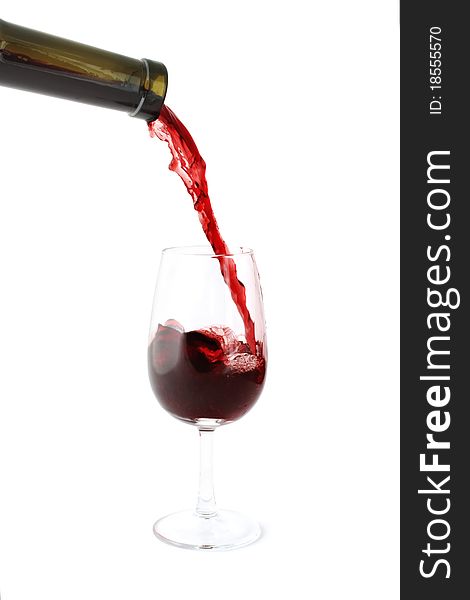 Red wine pouring into a glass. Isolated on white background.